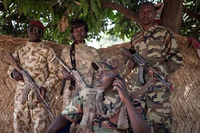 Le chef rebelle Ahmat Bahar devant son domicile à Bétoko, au nord-ouest de la République centrafricaine. Crédit photo : AFP.The self-proclaimed General Ahamat Bahar, ex-Seleka, ex-FPRC (Front populaire pour la renaissance de la Centrafrique), ex-MPC (Central African Patriotic Movement) co-founder, and now leader of the armed group MNLC, poses for photographs in front of his home in Betoko, northern Central African Republic, on December 27, 2017. / AFP PHOTO / ALEXIS HUGUET le-Général-autoproclamé-Ahmat-Bahar-à-Bétoko-IMG_17janv2018100900 Le général autoproclamé Ahmat Bahar arrêté à la frontière tchado-centrafricaine.